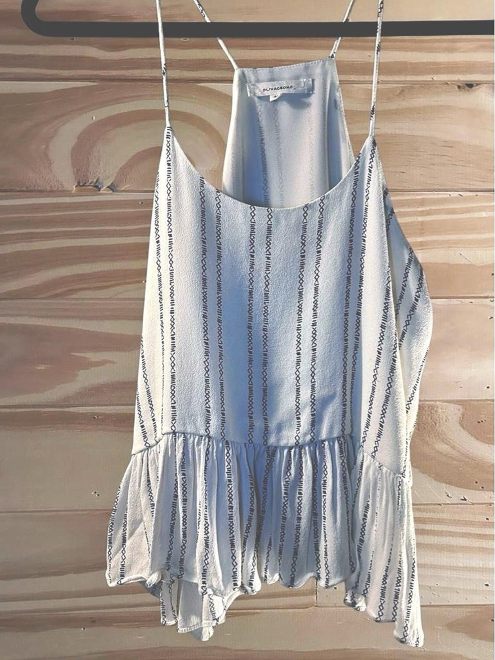 Olivaceous white and blue striped halter top with design. Size M .
